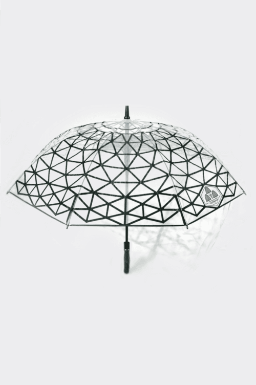 Product photo on white background. Photo depicts a transparent umbrella with a black geometric pattern resembling a geodesic dome, minimalist design, modern, sleek. The black print on the umbrella casts a light shadow of the geodesic pattern.