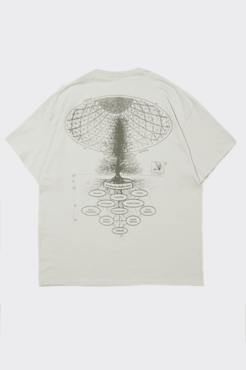 A beige t-shirt laid flat and viewed from the back. It features a detailed illustration of a tree with a dome-shaped structure above it, along with various labels and an intricate design extending downward from the roots. Text and a small graphic are also visible.